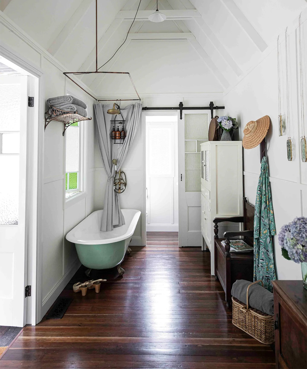 a claw-footed tub inside a small cabin