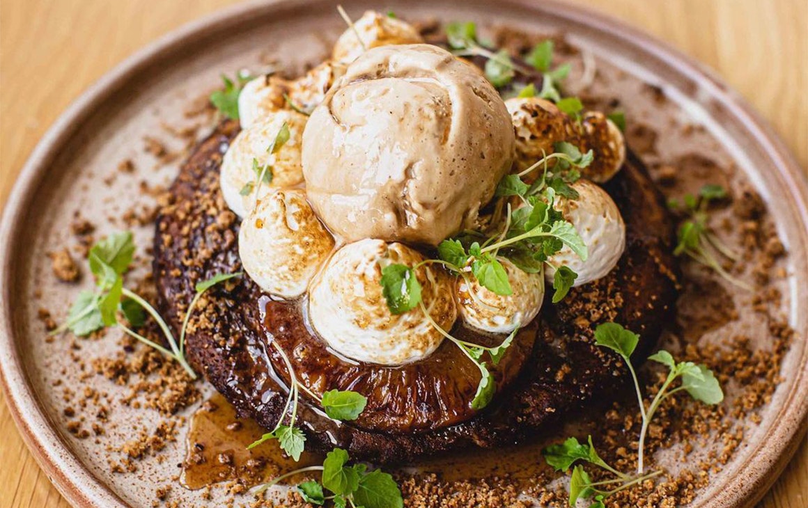 a pancake topped with loads of cream