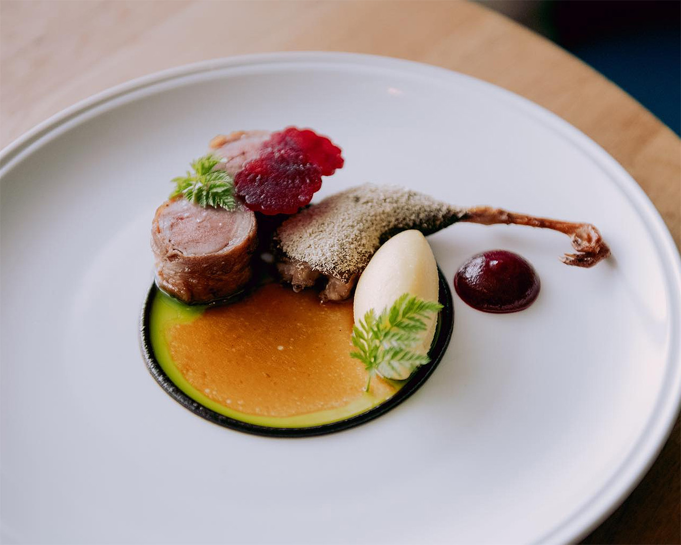 Little bird, lots of flavour. Quail, black garlic, smoked potato, beetroot on a plate at Paris Butter.