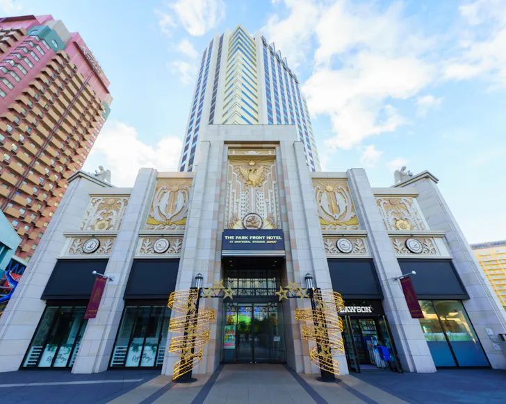 The impressive, blue and gold facade of The Park Front Hotel at Universal City Osaka.
