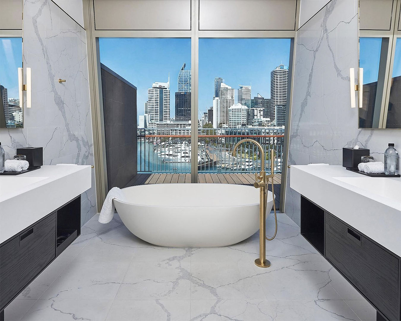 A bath in front of stunning views in a room at The Park Hyatt Auckland.