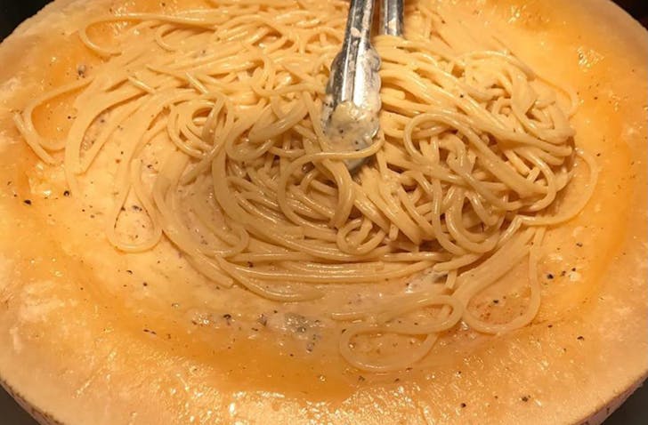 Pasta in a giant wheel of cheese.