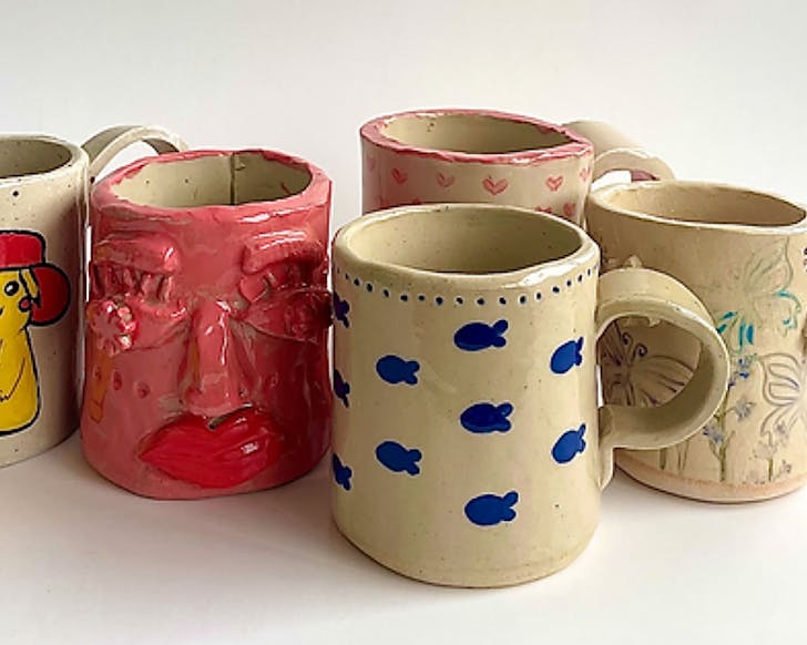 An assortment of cute handmade mugs with varying patterns, colours and moulds.