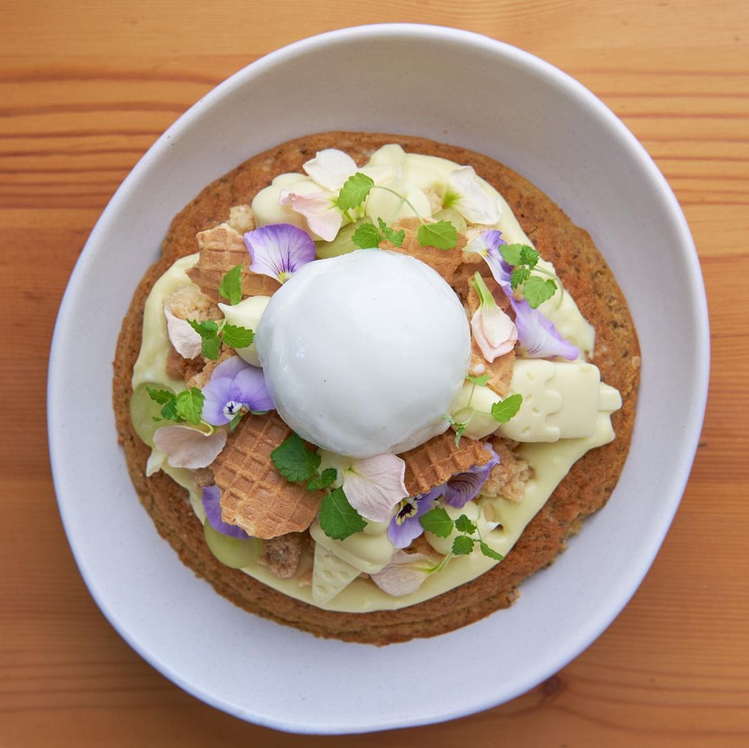 a pancake topped with ice cream and white chocolate