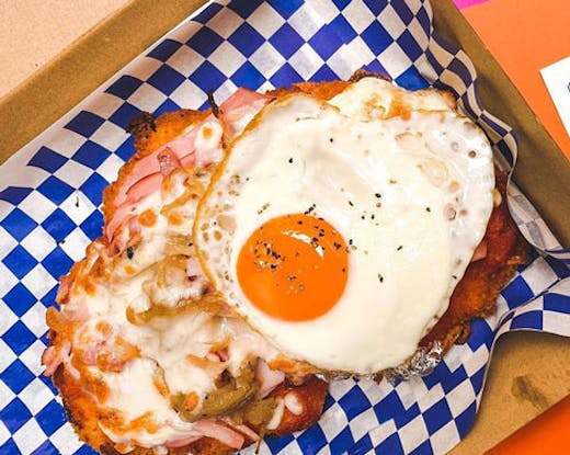 An Aussie parma from Peckers Parmas with an egg on top.