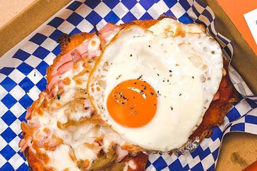 An Aussie parma from Peckers Parmas with an egg on top.
