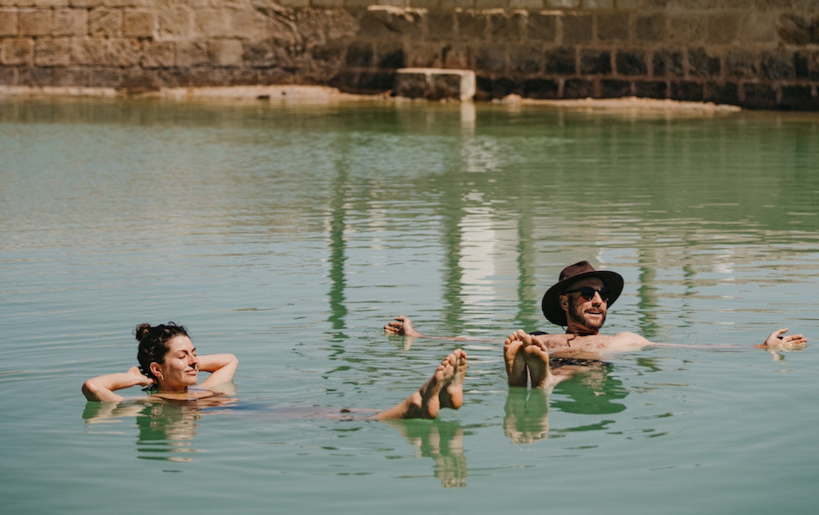 people floating in the saltwater pool near Wave Rock