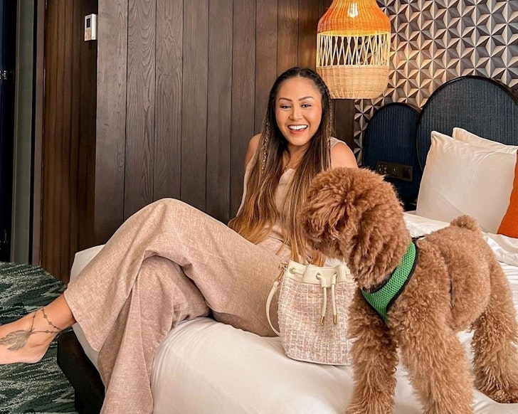 A woman with her dog in a room at Ovolo pet-friendly hotel Sydney