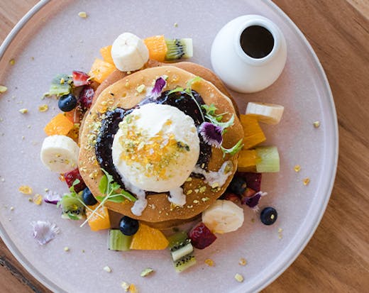 pancakes topped with fruit and ice cream
