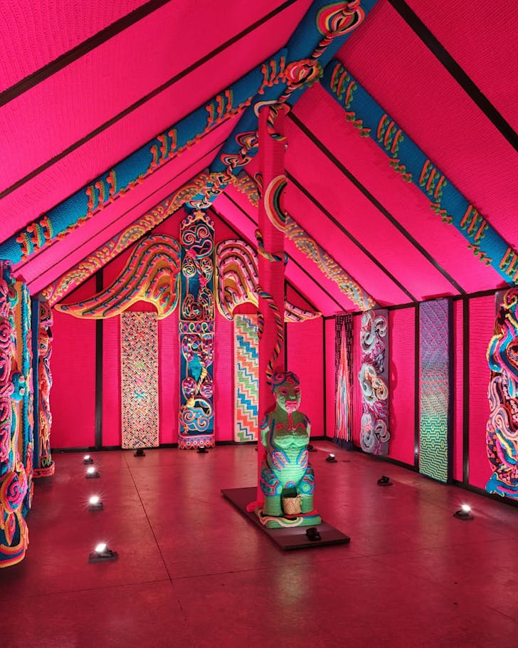 The bright pink and fantastically colourful inside of the crocheted Wharenui Harikoa.