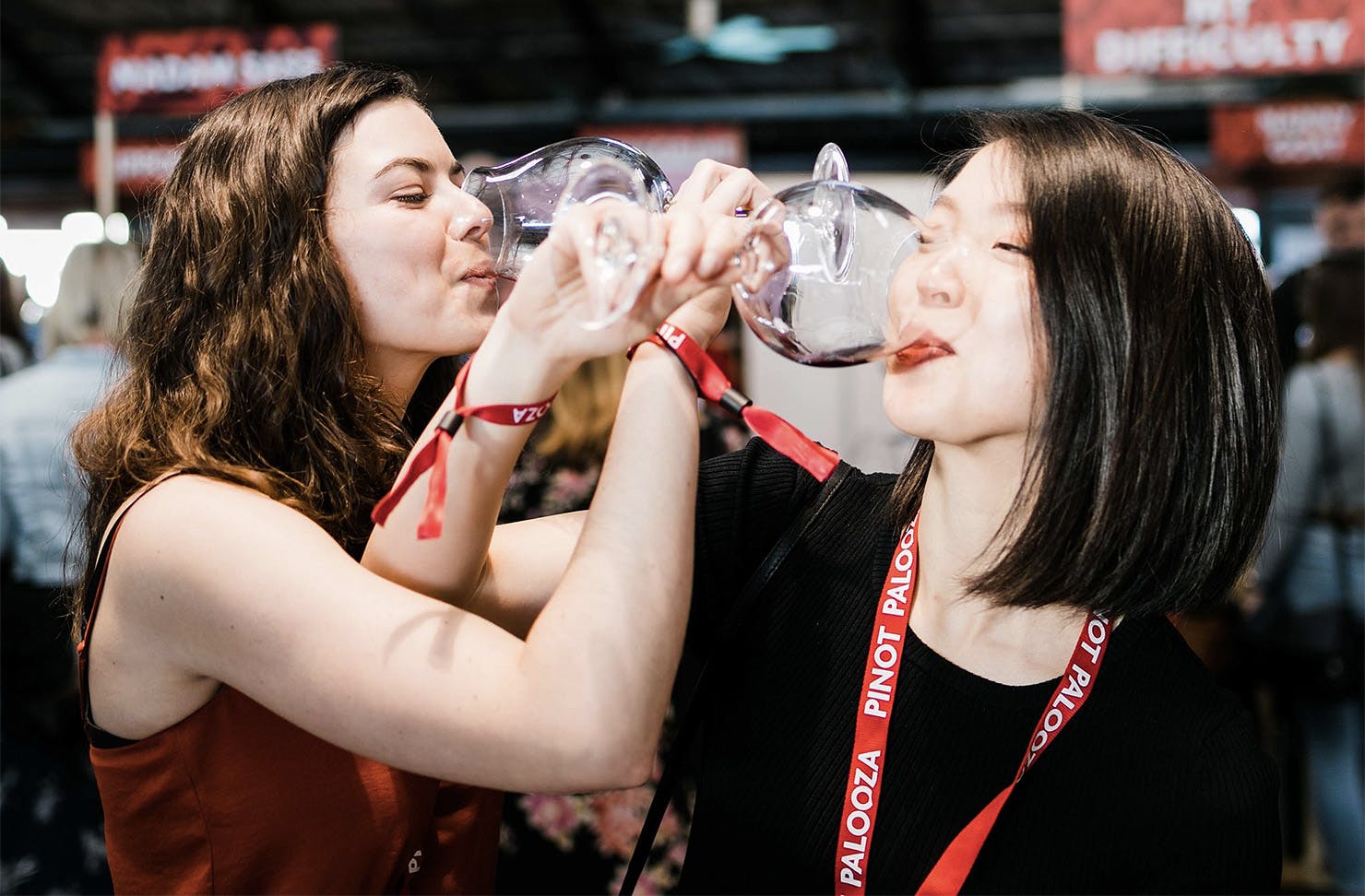 Two ladies enjoy a good drop of Pinot Noir.