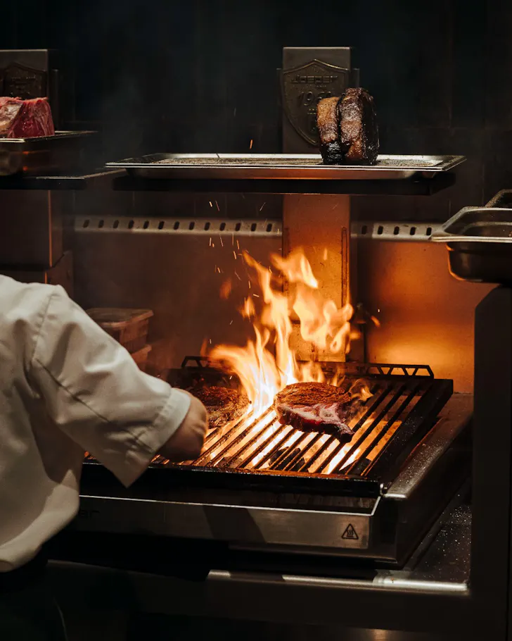 Poetica Bar and Grill charcoal cooking