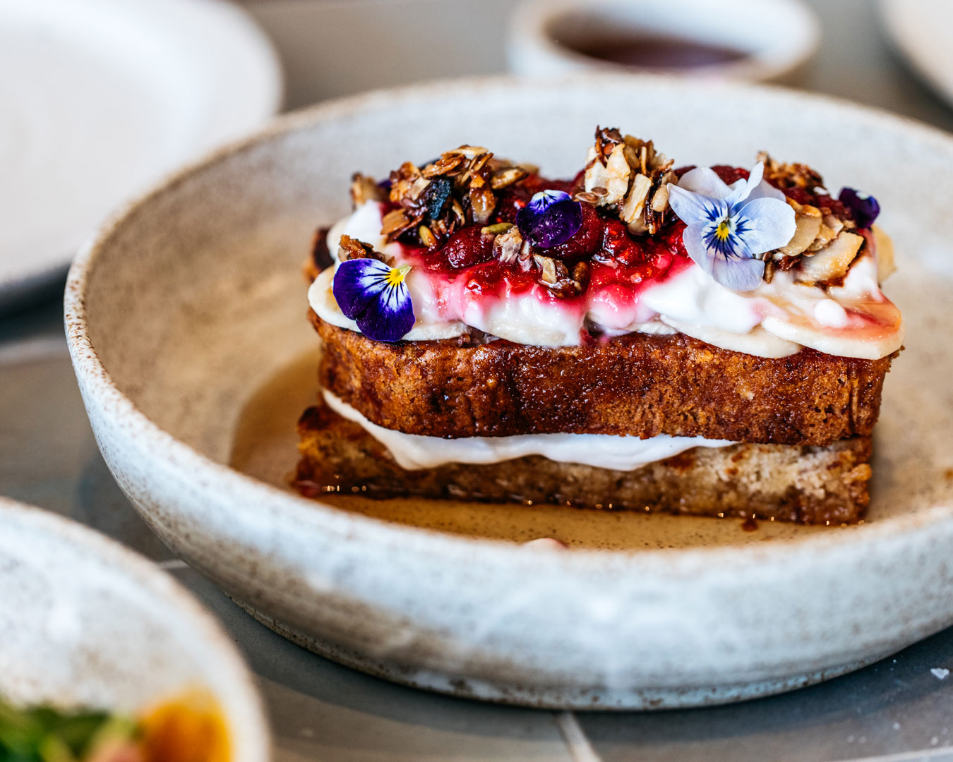 Frecnh toast in a ceramic bowl from a cafe in Bondi