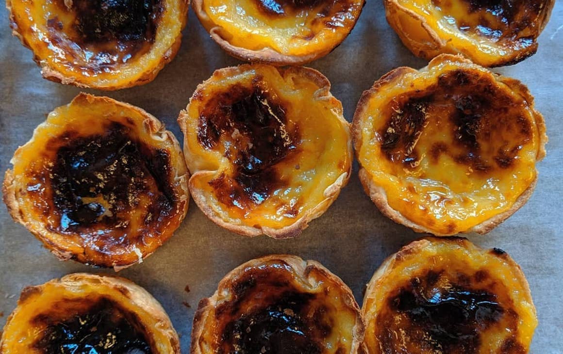 a tray of Portuguese tarts