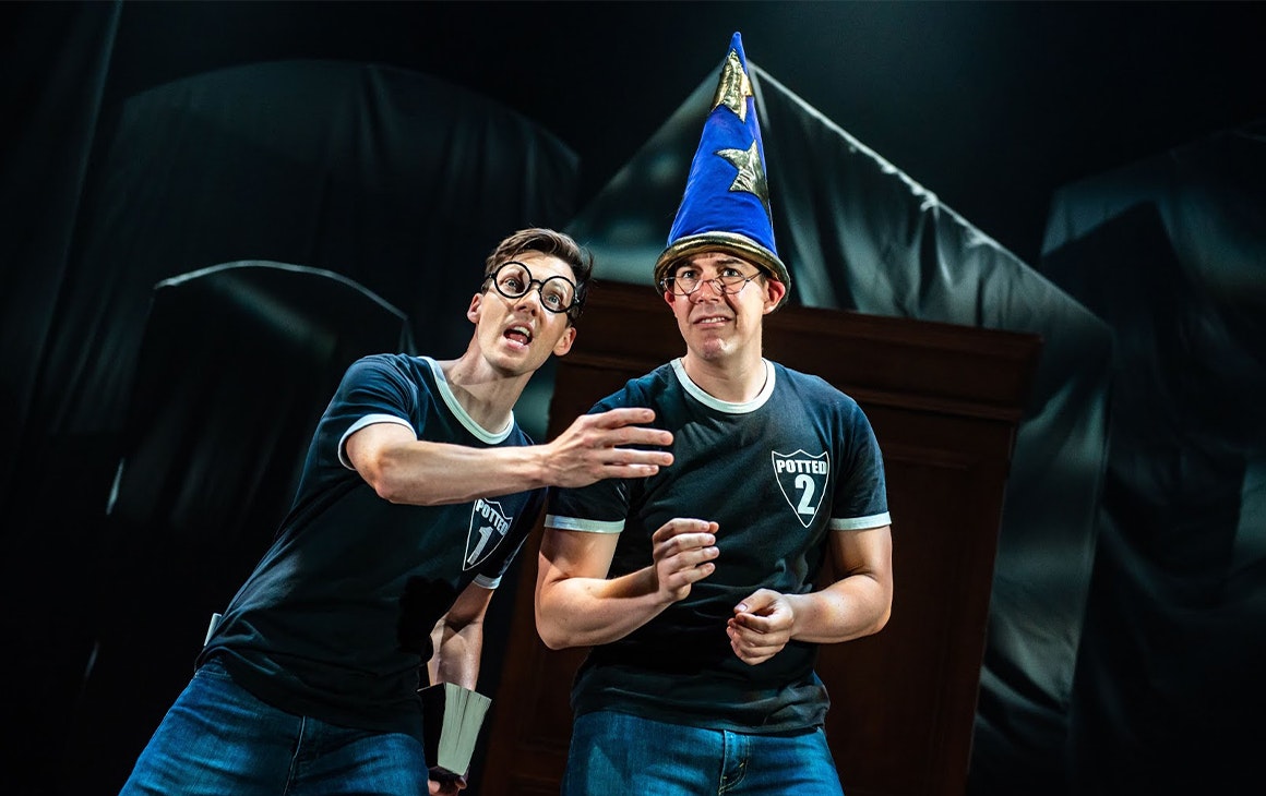 two people on stage dressed as harry potter and dumbledore