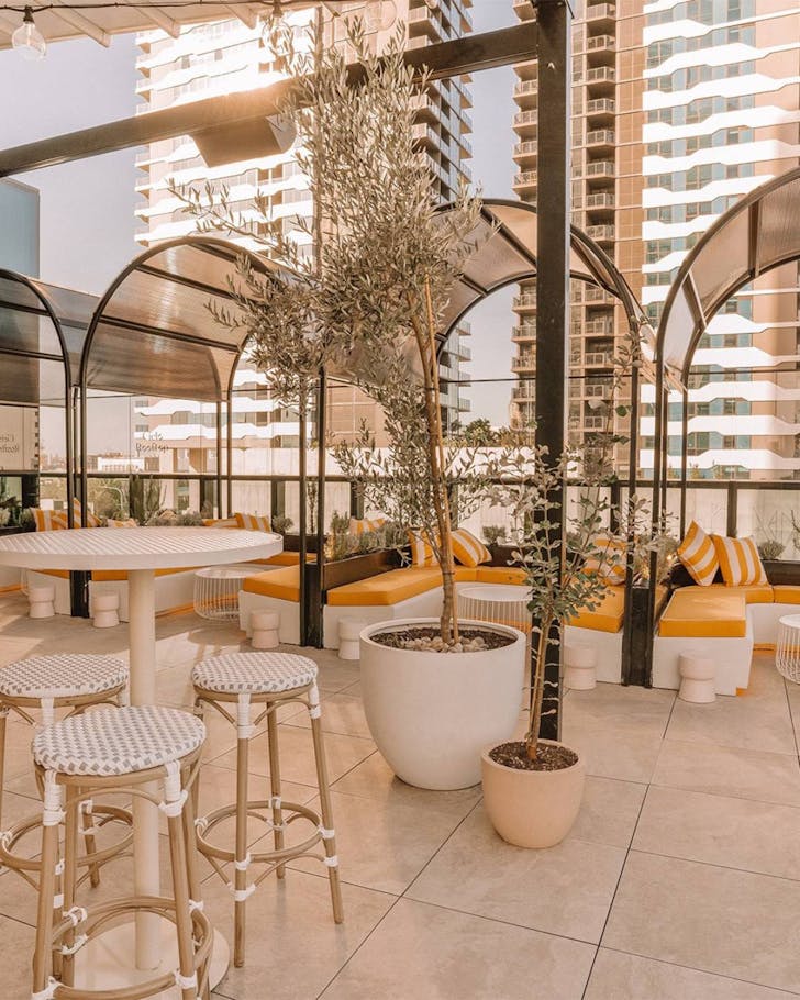 rooftop bar with seating and tables