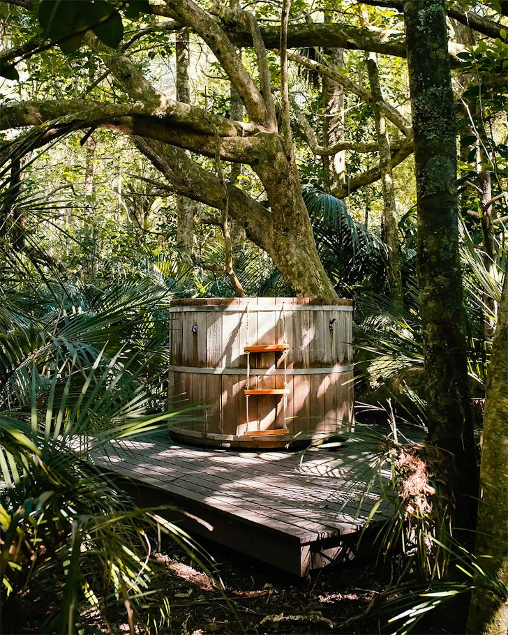 The outdoor hot tub at Private Bush Retreat one of the best romantic stays near Auckland