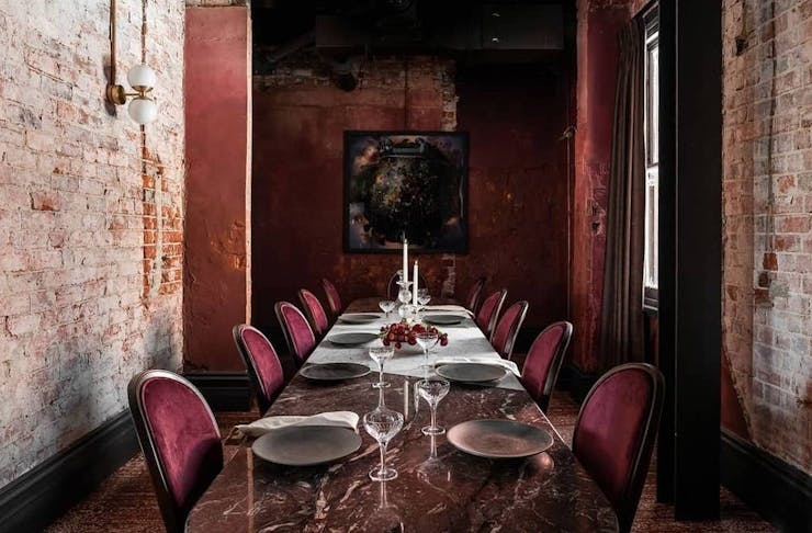 a private dining room in Perth featuring a red marble table