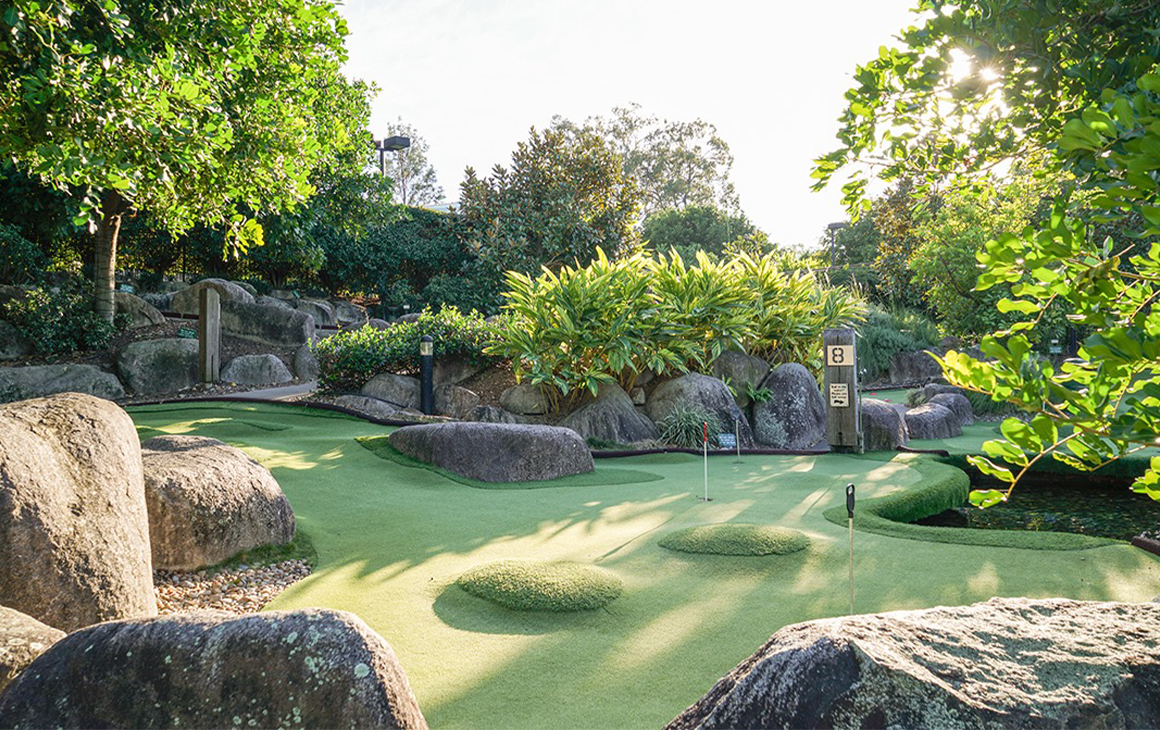 A putt putt course surrounded by trees