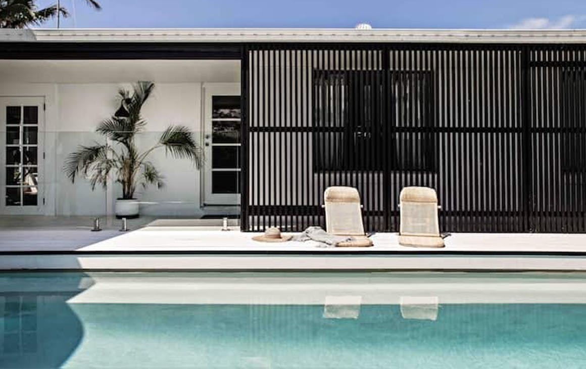A coastal style cottage, with a pool.