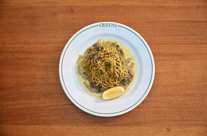 A Queens Matariki Special Pasta: hand-rolled saffron fettuccine with South Island creamed pāua and shaved black truffle.
