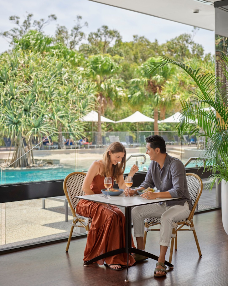 couple enjoying a beach poolside at RACV noosa