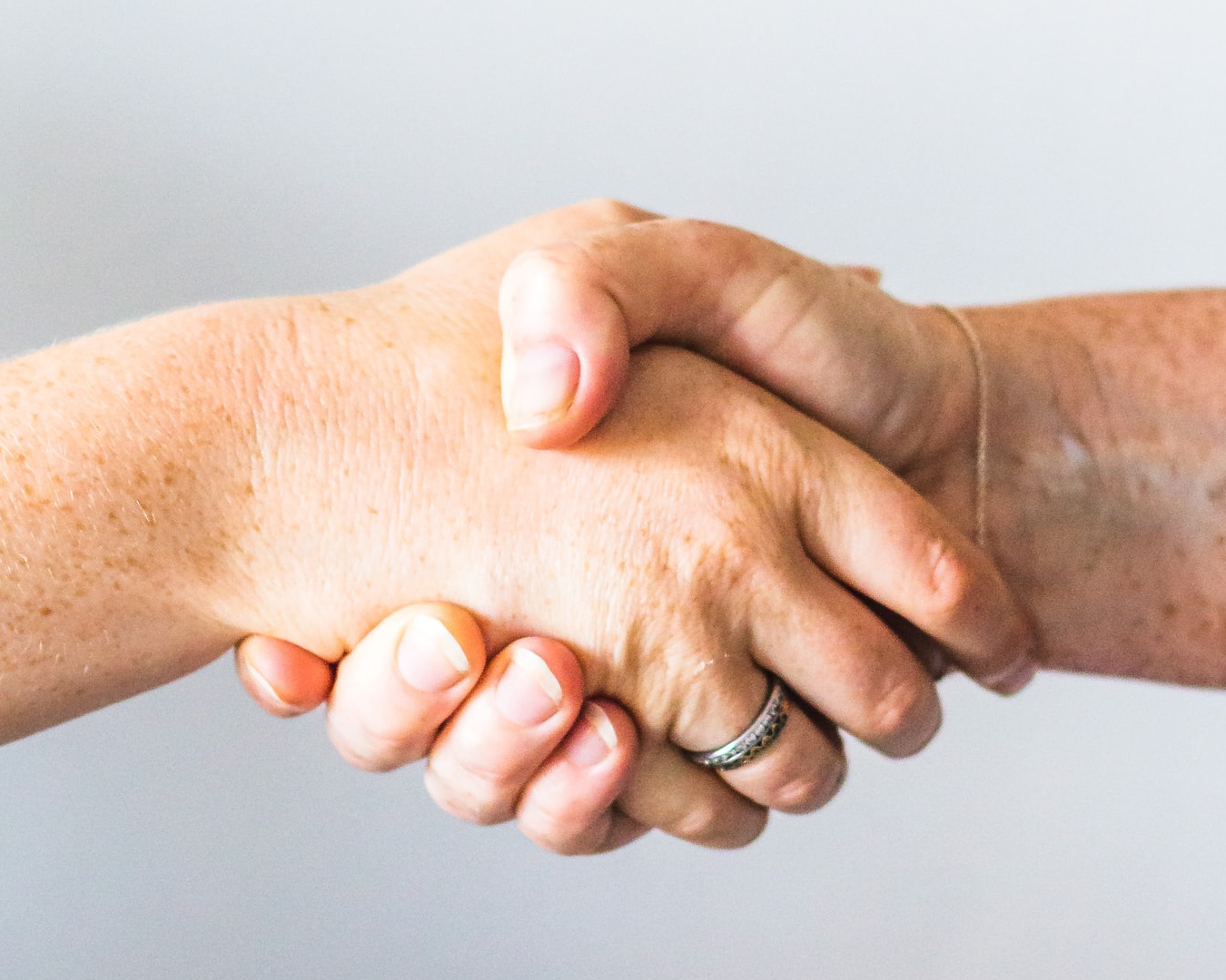 Two people holding hands