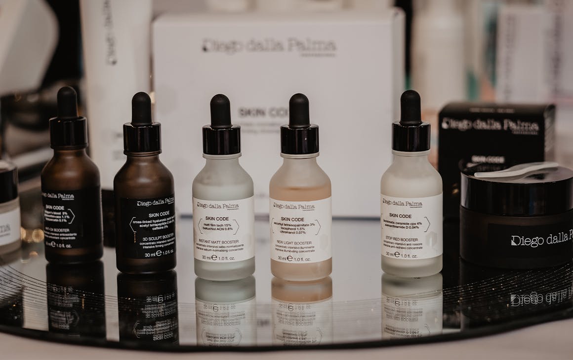 several glass bottles of serum