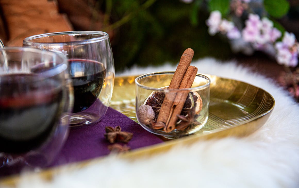two glasses of mulled wine on a tray