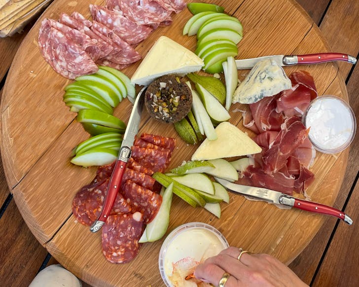 Round plate of cheese, meat and bread