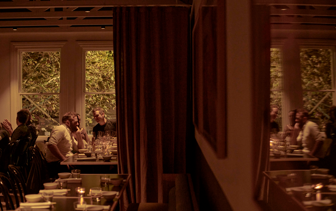 A charming dining room with people enjoying a meal inside at one of Melbourne's best restaurants, Lagoon Dining