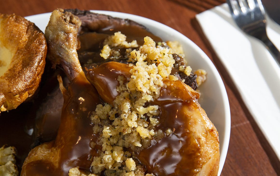 A roast dinner with stuffing and gravy
