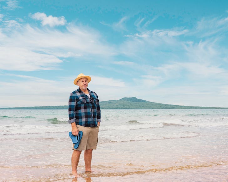 'Dickie Hart' stands on Takapuna Beach on a sunny day.