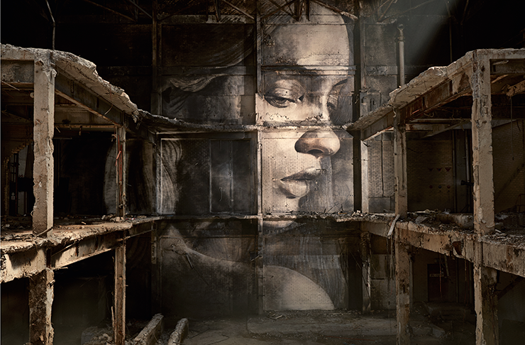 A detailed portrait of a woman's face behind several shelves in a dimly lit building.