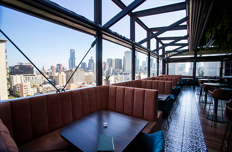 One of the best rooftop bars with booth seating and a bar. 