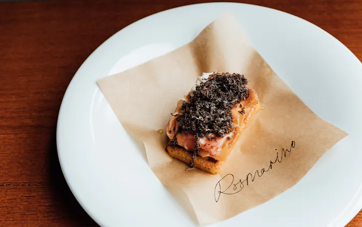 a bar bite dish topped with truffle