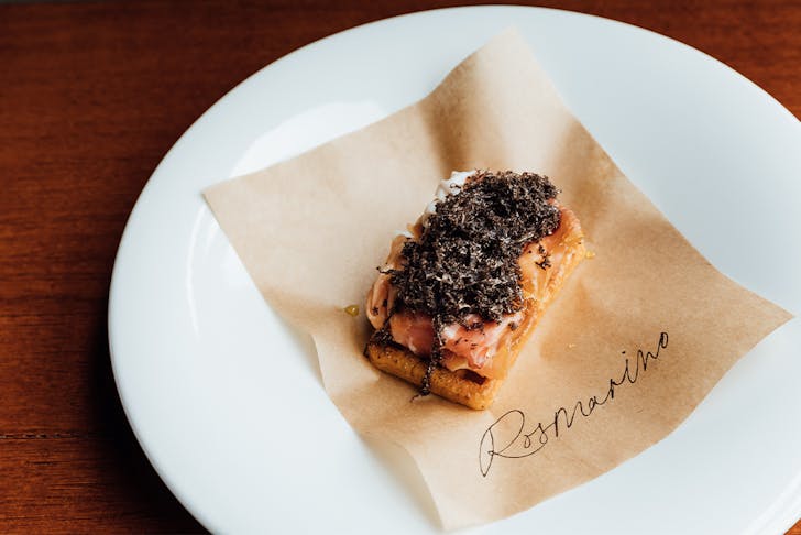 a bar bite dish topped with truffle