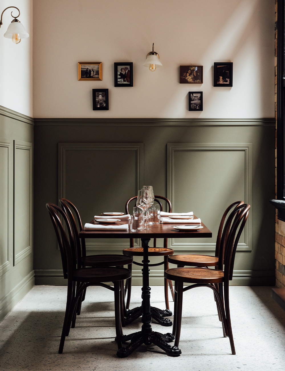 a table in a green dining area 