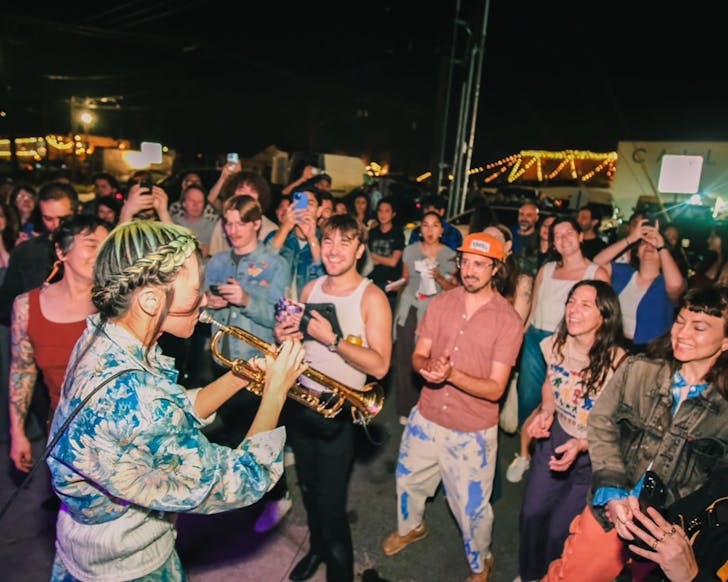 ROUTE14 play to an outdoor crowd.