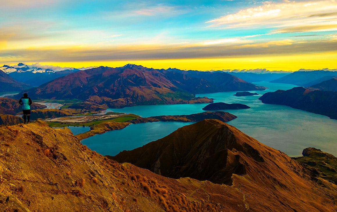 Traveler enjoying the sunrise at Roys Peak