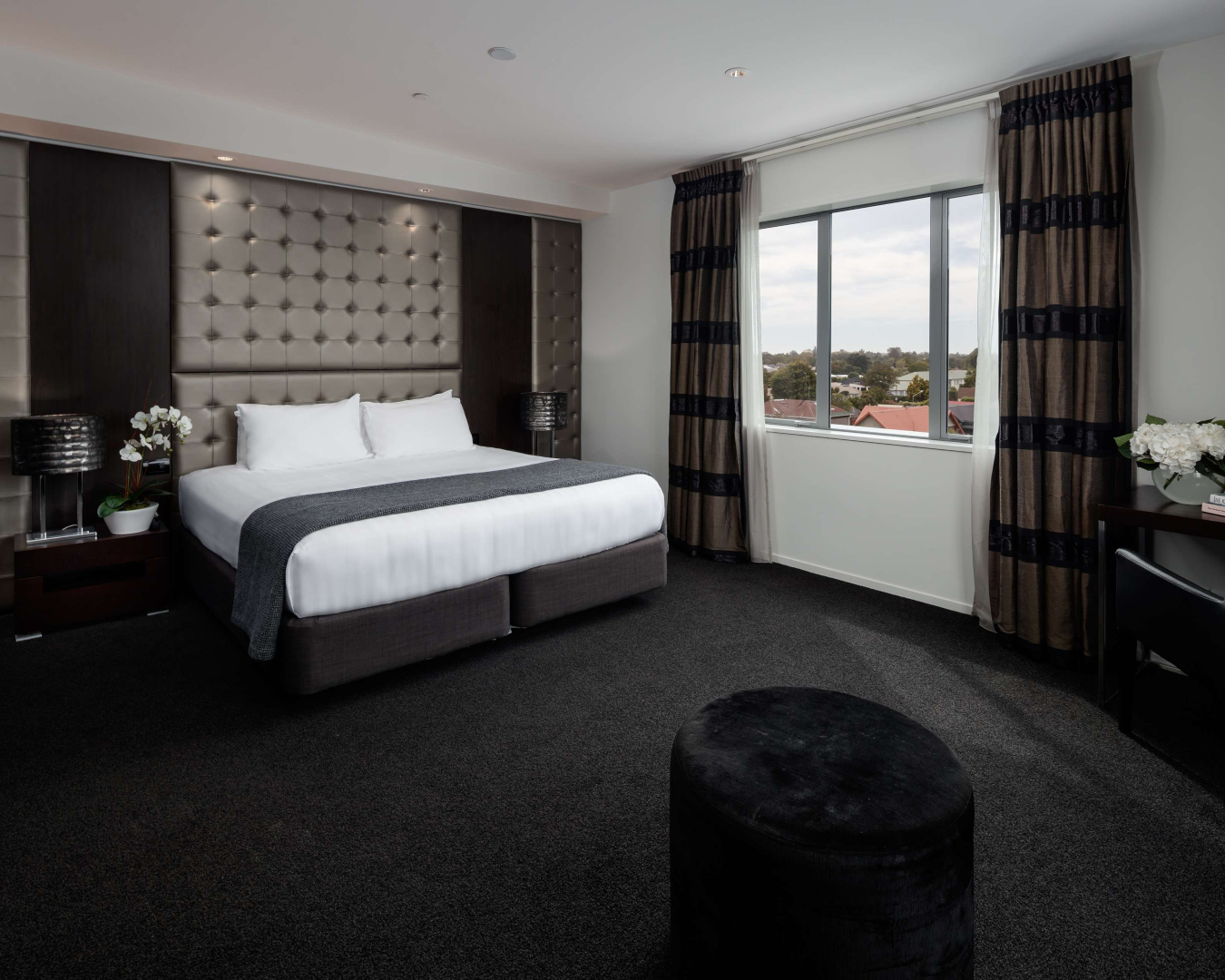 Classy and stylish, a room at The Rydges is decked out with luxurious monochromatic decor 