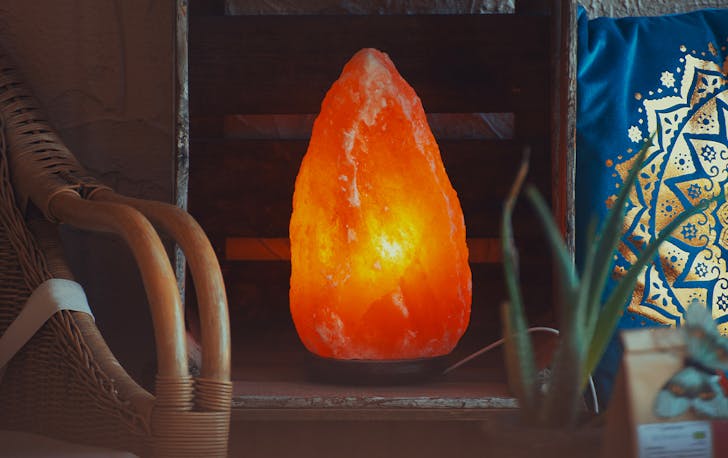 a salt lamp on a bench