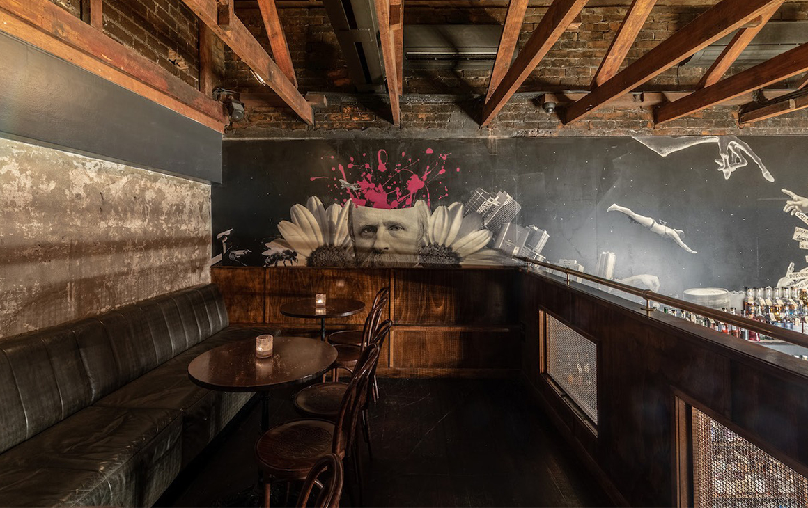 a loft seating area inside a bar