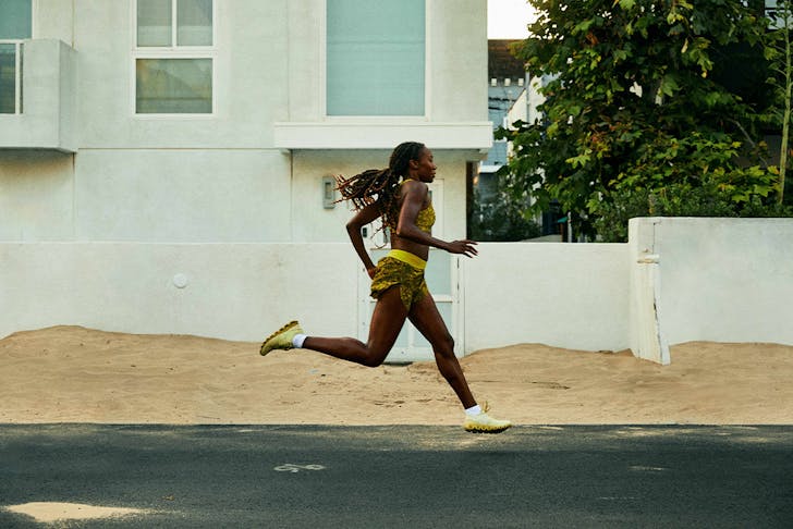a woman running down a street