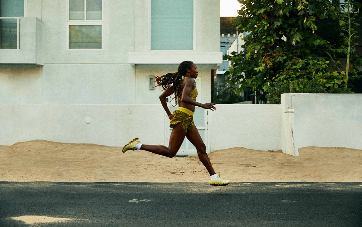 a woman running down a street