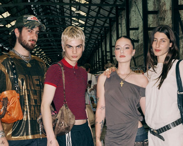 A mid shot of four young people dressed in fashionable, vintage-looking clothing. They appear to be standing inside Carriageworks at the Second Life Markets venue.