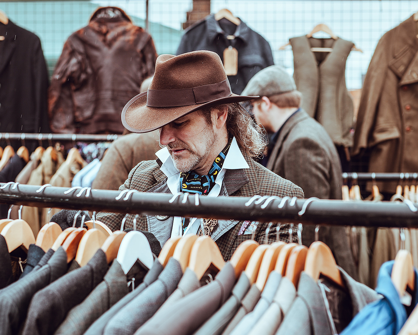 A man shops for new second hand threads.