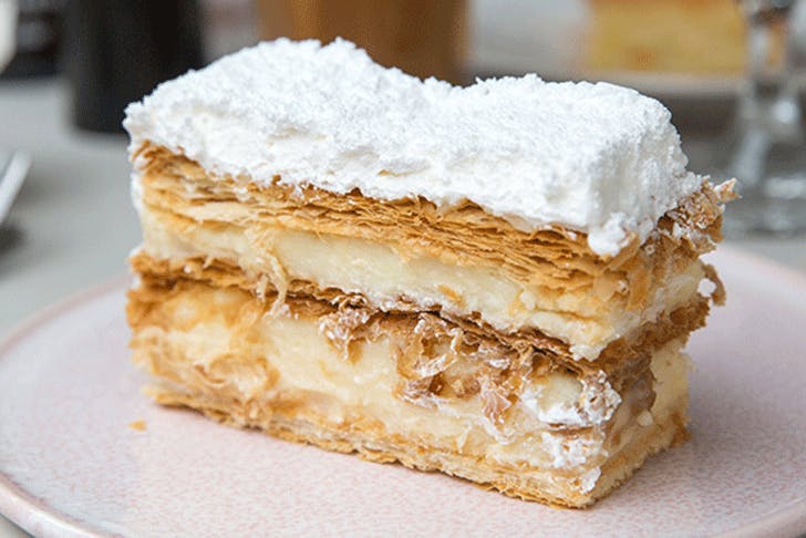 A delicious mille-feuille with flakey pastry, filled with custard and topped with white icing.
