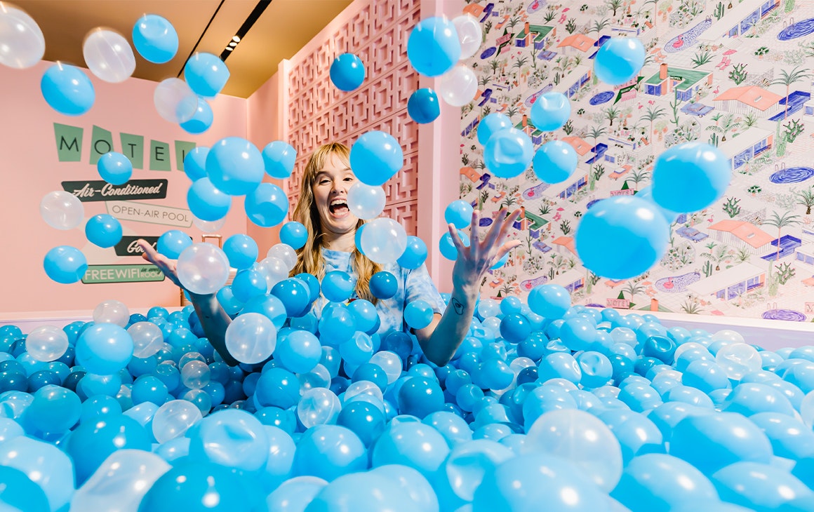 a woman in a blue ballpit