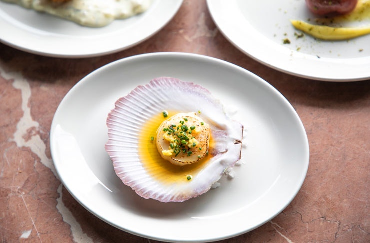 A scallop presented in its shell. 